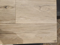 BECKHAM BROTHER'S Posh Plank Windsor features light wood-grain glue down vinyl tiles with natural knots and texture.