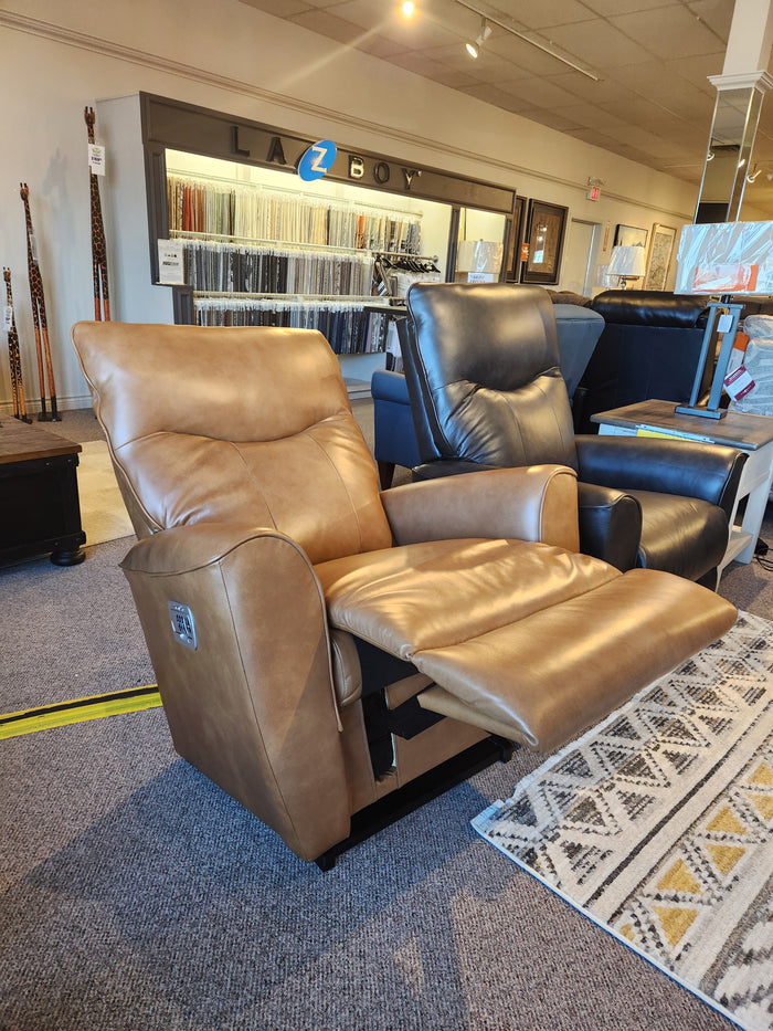 Two La-Z-Boy 804 Belmont Power Rocker Recliners with heat tilt, one tan, one dark brown, in a showroom.