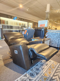 A dark brown La-Z-Boy 804 Belmont Power Wall-A-Way Recliner With Heat Tilt is on display in a furniture showroom.