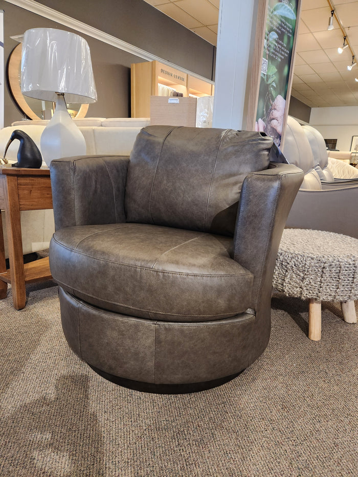 The Best Tina Swivel Chair boasts retro-mod charm with a gray leather barrel design, perfect for any stylish space.