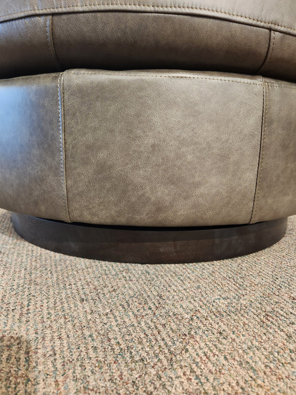 Close-up of the Best Tina Swivel Chair’s base, showcasing its barrel silhouette on a carpeted floor.