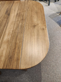 A Handstone 3 Piece Parker Dining Table Set with a visible seam sits on a light-colored carpeted floor.