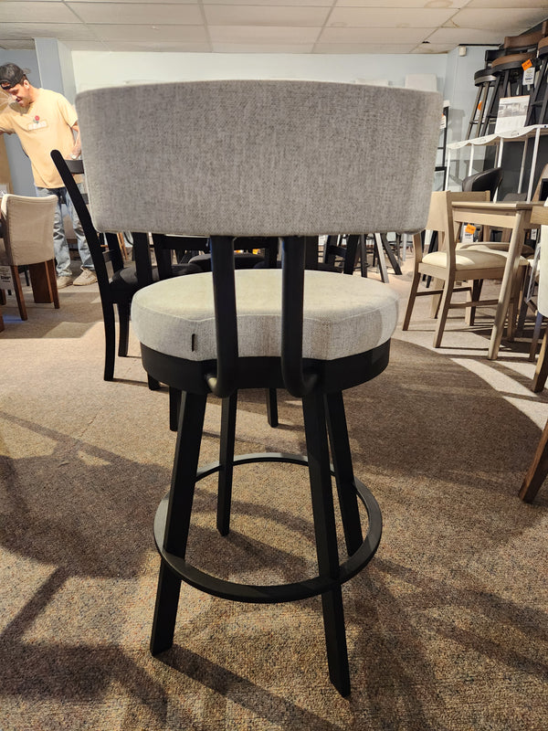 Barry Swivel Bar Stool by Amisco: gray cushion, black steel legs, scratch-resistant finish, shown with other chairs.