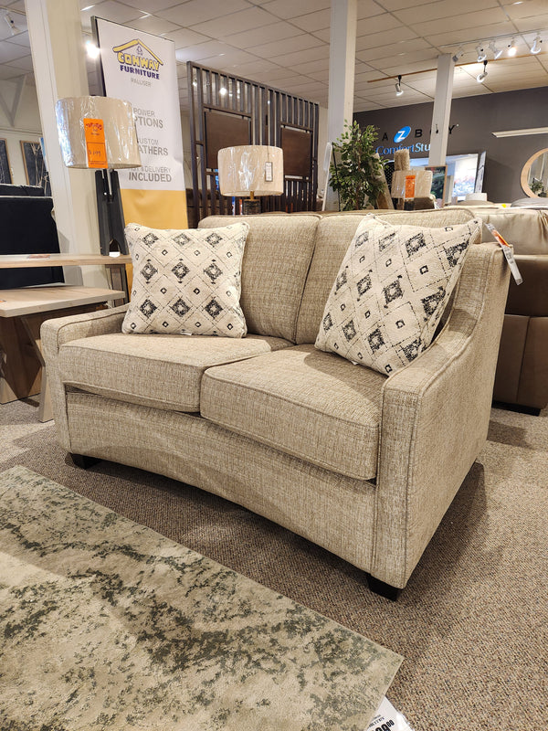 Superstyle 9670 Loveseat, beige, medium-firm seat, patterned pillows, displayed in a Canadian showroom.