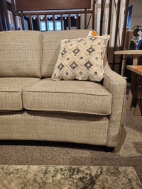 Superstyle 9670 Sofa with compact frame and patterned cushion, showcased in a Canadian furniture showroom.