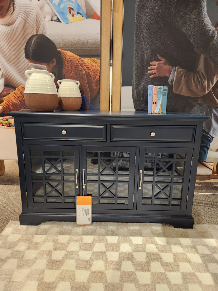The Jofran 775 Craftsman Console is a navy media cabinet with antique hardware, two drawers, and glass-front doors.