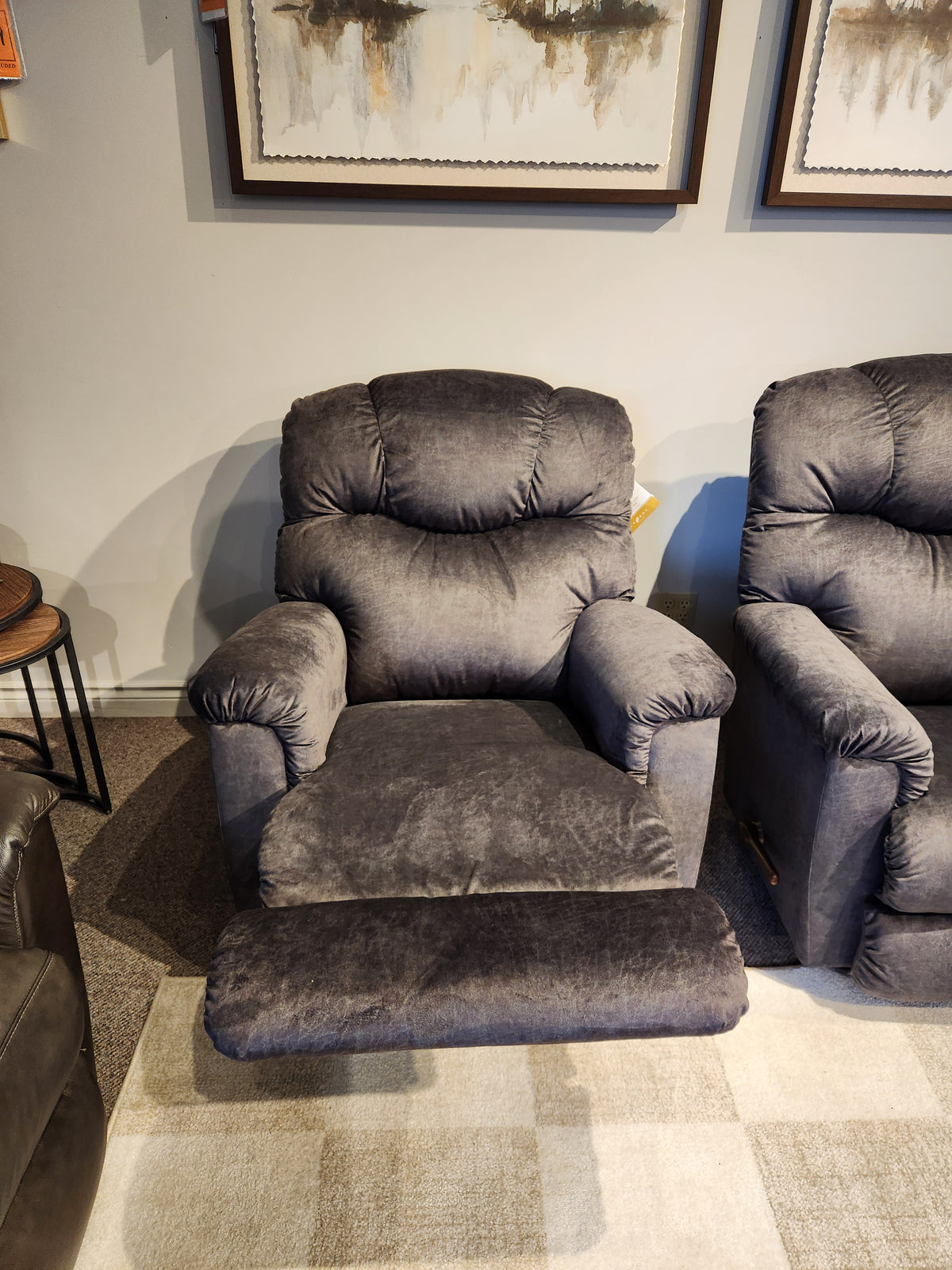 A La-z-boy 515 Lancer Wall-A-Way Recliner in gray sits on a beige carpet in a cozy living room.