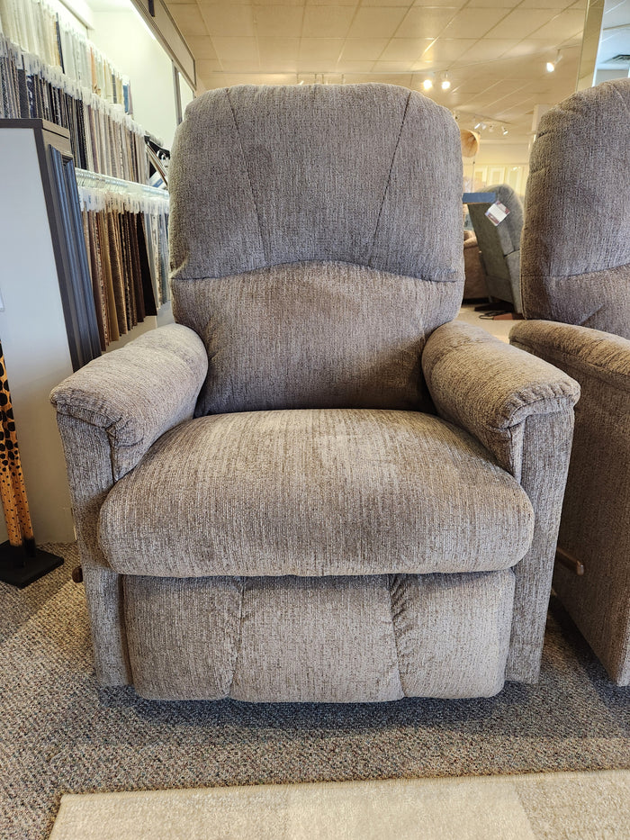 La-z-boy 795 Mercury Rocker Recliner in gray upholstery on display with fabric samples and chairs in the store.