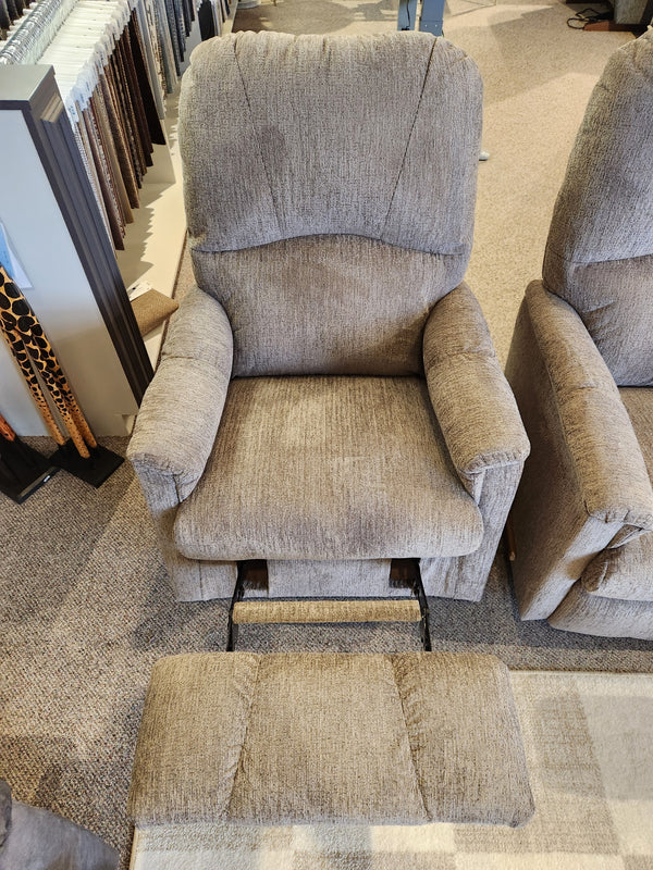 The La-z-boy 795 Mercury Rocker Recliner in gray, footrest extended, displayed in a furniture store.