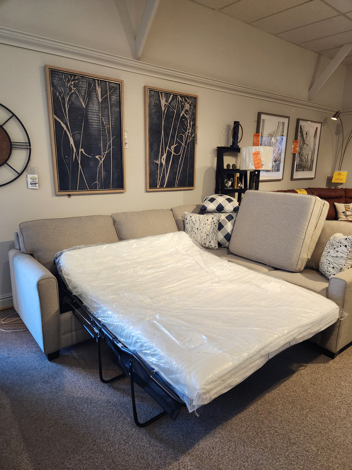 The Superstyle 1014 Trinity Double Sofabed Sectional in beige is displayed unfolded with the mattress in plastic.