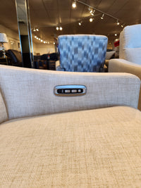 Close-up of La-Z-Boy 810 Quinault Power Reclining Loveseat with Zero G & Headrest and armrest control panel in a store.