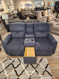 The La-z-boy 780 Hawthorn Reclining Loveseat With Console is displayed in a showroom with chaise seats and cup holders.