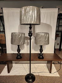 The Chandler 3 Piece Lamp Set by Adesso Lamp includes a bronze floor lamp and two table lamps with plastic-covered shades.