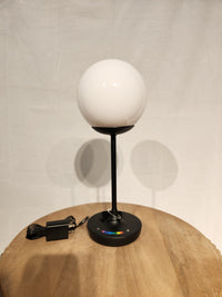 The Adesso Lamp Millie Color Changing Table Lamp features a touch base, sphere shade, and is perfect for outdoor mood lighting.