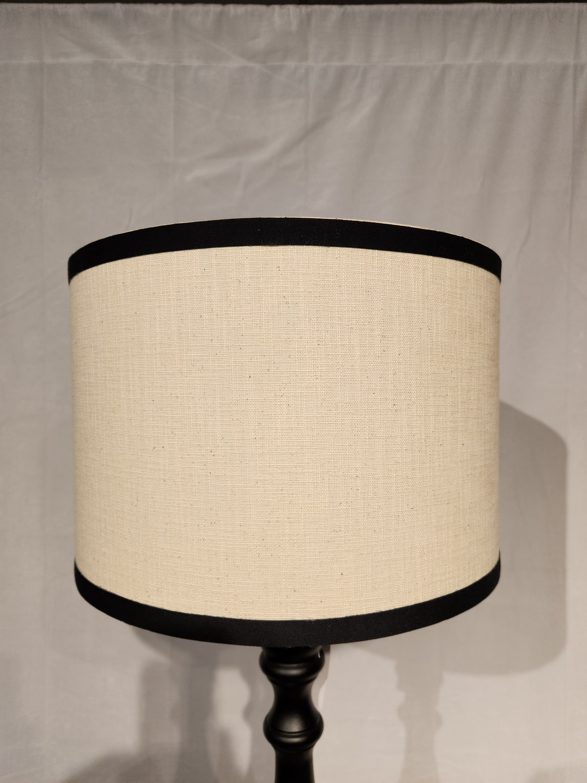 The Adesso Zeek Table Lamp features beige with black trim, a 3-way rotary switch, and a black rubberwood base.