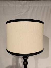 The Adesso Zeek Table Lamp features beige with black trim, a 3-way rotary switch, and a black rubberwood base.