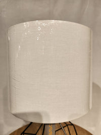 A close-up of the Chiara 2 Piece Set by Adesso Lamp, featuring white textured shades and black metal bases with AC outlets.