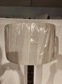 A beige shade complements the farmhouse style of the Adesso Lamp Kona Floor Lamp against a light background.