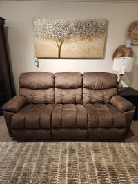 La-Z-Boy 766 Morrison Reclining Sofa with plush cushioning on a patterned rug, wall art, and lamp in the background.