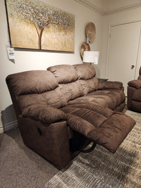 La-Z-Boy 766 Morrison Reclining Sofa with channel tufted seats, shown in a showroom with tree art and wall decor.