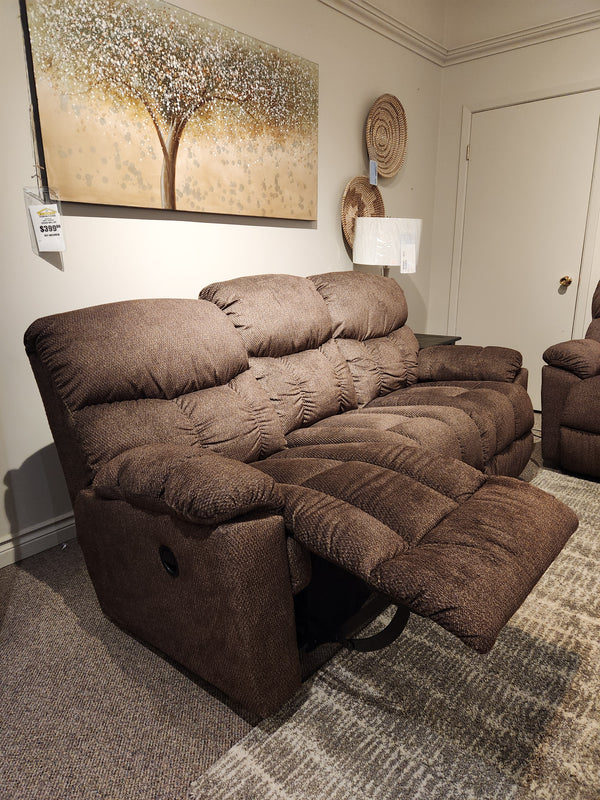 La-Z-Boy 766 Morrison Reclining Sofa with channel tufted seats, shown in a showroom with tree art and wall decor.