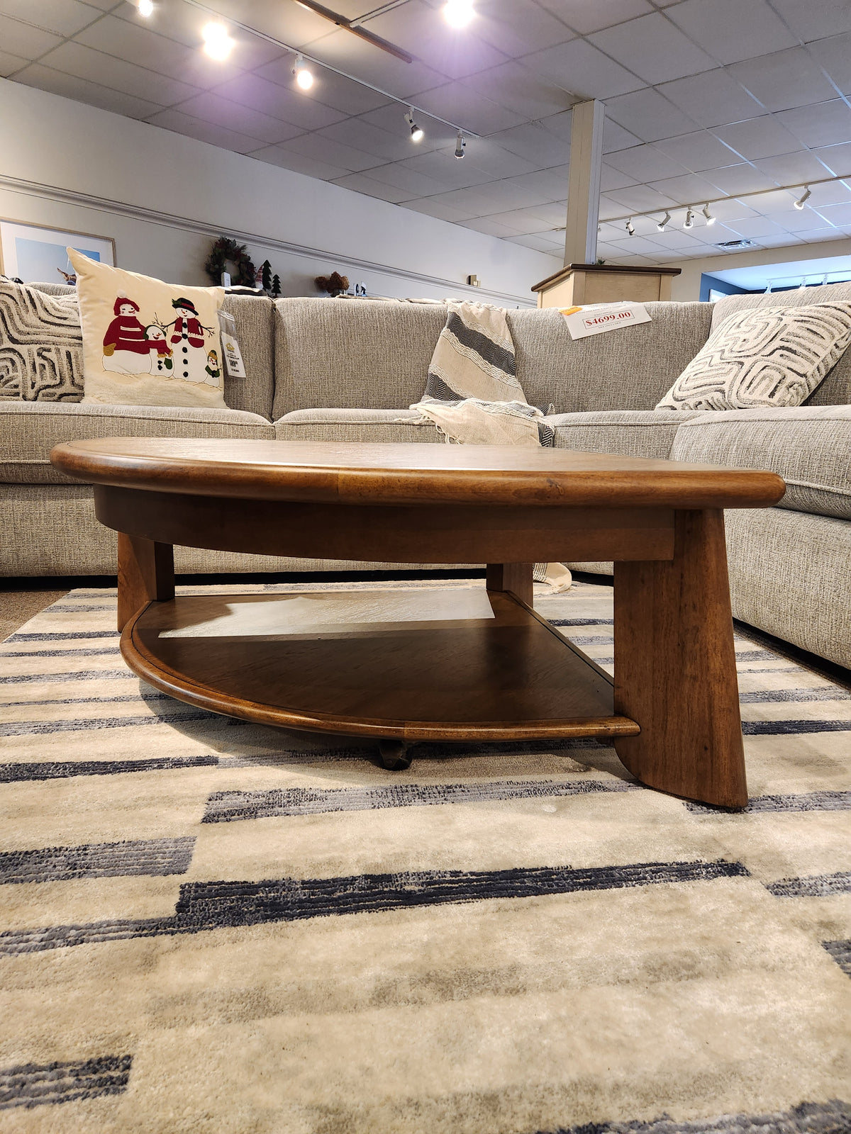 The Magnussen T6354 Tanner Pie Shape Lift Top Cocktail Table brings California Casual style with a tawny brown finish.