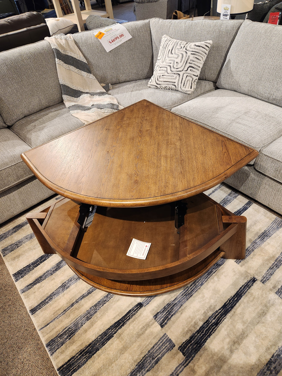 The Magnussen T6354 Tanner Pie Shape Lift Top Cocktail Table in Tawny Brown adds California casual style to your space.