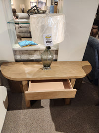 The Magnussen T6348 Hayden Sofa Table in Golden Oat finish is ideal for organic coastal farmhouse decor.