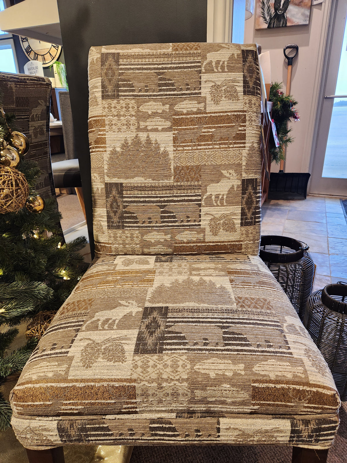 Best Odell dining chair: Lodge-inspired upholstery with rustic bears, trees, and geometric patterns in warm earth tones.