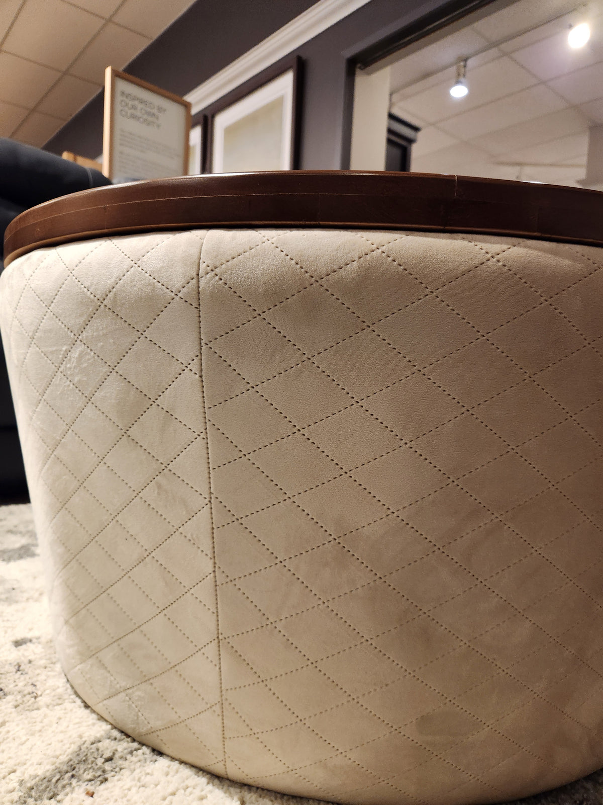 The Decor-rest 6415 Lift Top Storage Ottoman/Coffee Table features quilted beige fabric and wooden trim for a chic look.