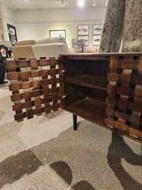 The Jofran Trent Woven Front Accent Cabinet 60" features woven-pattern doors and roomy shelves inside.