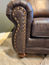 Close-up of the Best Field & Stream Noble Chair armrest with brass studs, ideal for modern lodge-style decor.