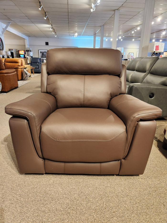 The Palliser 41051 Henry Wall-hugger Reclining Chair is showcased on a carpeted floor in a well-lit showroom.