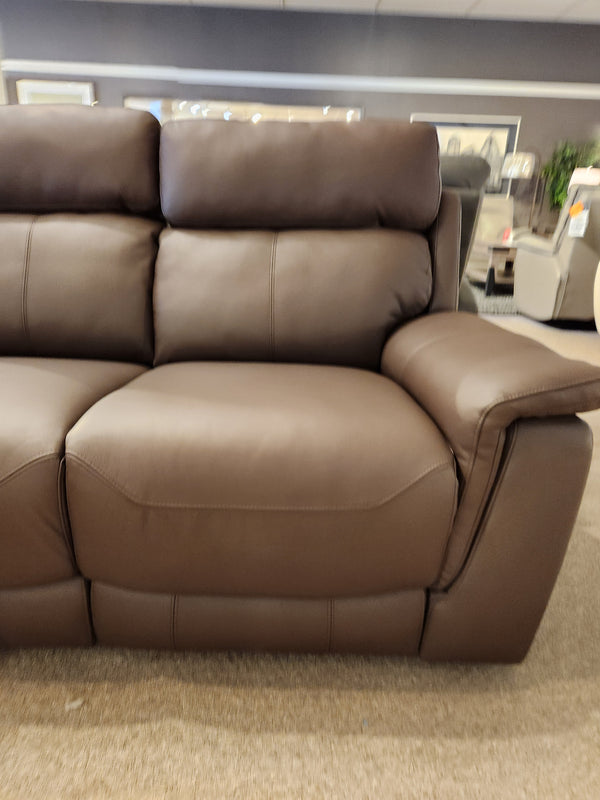 Palliser 41051 Henry Loveseat in brown leather with power headrest on display among art and other showroom furniture.