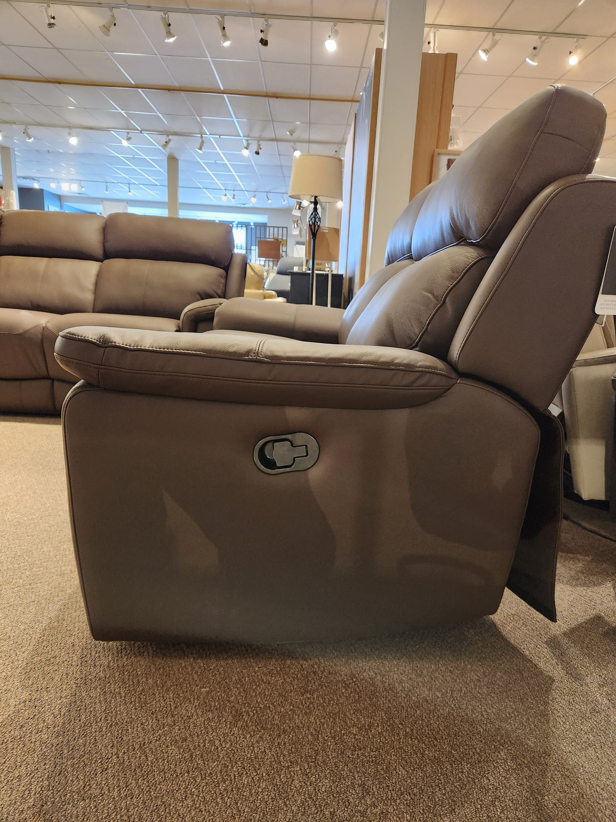 Palliser 41051 Henry Loveseat, part of our upholstery collection, showcased in a showroom with sofas behind.