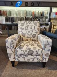 La-Z-Boy 431 Scarlett High-Leg Recliner in beige floral pattern shown in showroom with fabric samples behind.