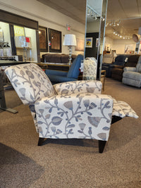 A La-z-boy 431 Scarlett High-Leg Recliner with floral pattern and extended footrest is displayed in the showroom.