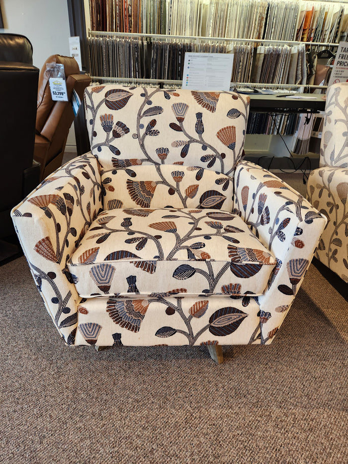 The La-Z-Boy 421-210 Bellevue High Leg Swivel Chair is cream, vintage-style, with floral and leaf patterns on display.