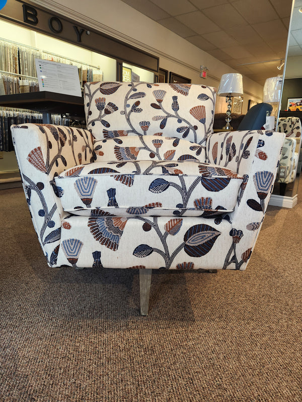 La-Z-Boy 421-210 Bellevue High Leg Swivel Chair with floral upholstery on display in a carpeted showroom.