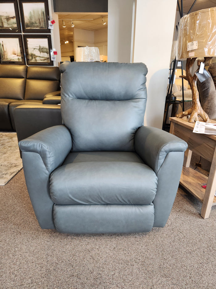 La-Z-Boy 820 Norton Rocker Recliner with ergonomic design on carpeted floor among other chairs in a furniture store.