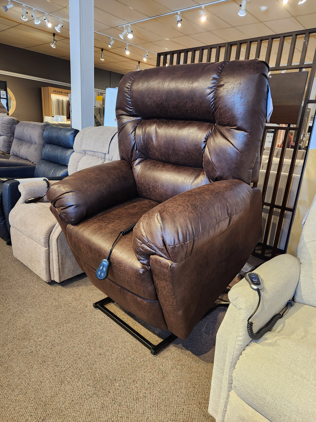 The Best 1B52 Troubadour heavy duty brown lift chair recliner with remote is on display in the showroom.