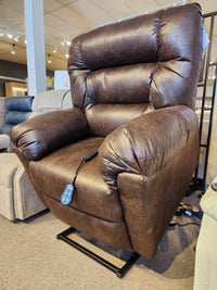 Best 1B52 Troubadour brown leather lift chair recliner with remote control shown in a furniture showroom.
