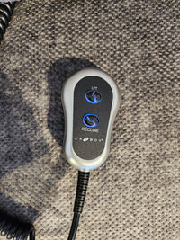 La-z-boy 793 Jean Bronze Lift Chair remote with blue "Lift" and "Recline" buttons on a textured gray surface.