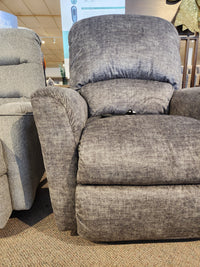 La-z-boy 793 Jean Bronze Lift Chair displayed on a carpeted floor beside another chair in the showroom.