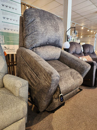 The La-z-boy 793 Jean Bronze Lift Chair with remote is on display in the furniture showroom.