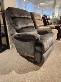 La-z-boy 519 Astor Rocker Recliner: tall gray fabric chair with wooden lever, featured in a furniture showroom.