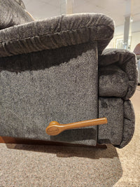 Close-up of the La-Z-Boy 519 Astor Rocker Recliner, a tall, comfy chair with wood lever, on a carpeted floor.