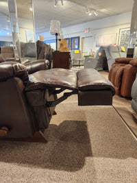 A La-z-boy 519 Astor Rocker Recliner with adjustable back cushion is shown on a carpeted showroom floor.