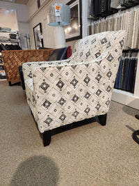 Superstyle 828 Jasmine Chair with black geometric pattern, made in Canada, displayed on a carpeted showroom floor.