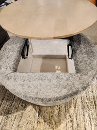 The Decor-rest 6415 Lift Top Storage Ottoman/Coffee Table features a gray textured finish and hidden storage inside.